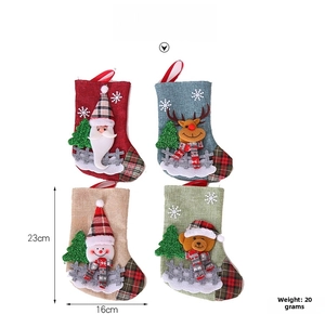 Size display of four Christmas stockings with Santa and reindeer 3D character details