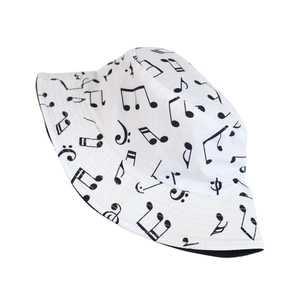 White bucket hat with black music note print and breathable canvas for sun protection