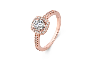 Detail view of rose gold ring with round center diamond and square halo pavé setting