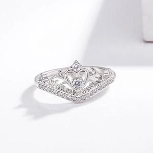 Detail of elegant crown ring with silver plating and shimmering micro-pave zircons