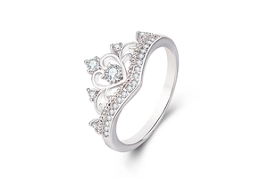 Detailed close-up of crown-shaped silver ring with white zircon and hollow heart patterns