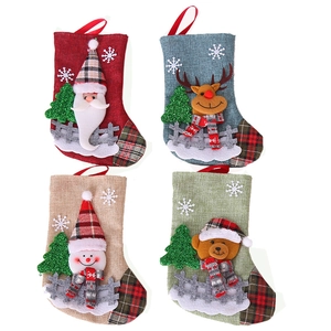 Set of four linen Christmas stockings with Santa, Reindeer, Snowman, and Bear embroidery
