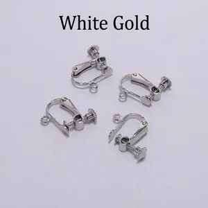 Detailed macro of four silver plated copper screw ear clips for jewelry making