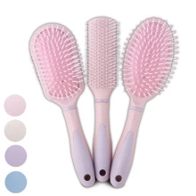 Detailed view of pink hairbrush set including paddle brush and vented styling combs
