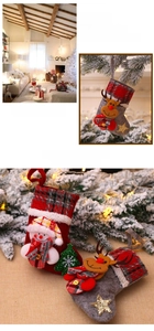 Detail of Christmas stocking ornaments with 3D snowman and reindeer in plaid fabric