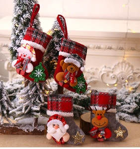 Detailed view of four festive Christmas stockings with 3D Santa and reindeer characters
