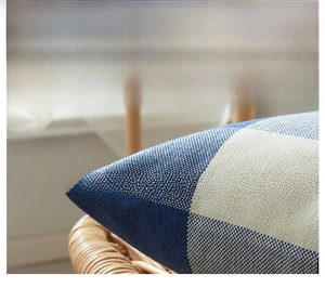 Detail of blue and white plaid linen pillowcase showing durable woven fabric texture