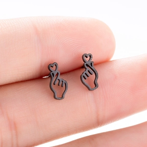 Minimalist black stainless steel heart hand gesture stud earrings on finger for size