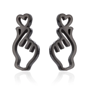 Detailed view of black heart-shaped gesture stud earrings on a clean white background