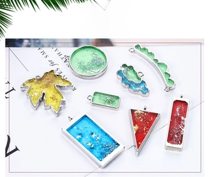 Detailed macro view of assorted colorful resin geometric pendant charms for DIY jewelry making