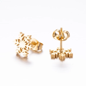 Elegant gold snowflake stud earrings with butterfly backings for a minimalist winter look