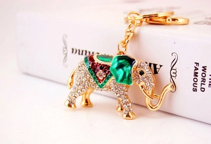 Close-up of golden elephant keychain with sparkling rhinestones and colorful enamel detail