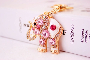 Macro view of crystal elephant keychain with pink rhinestones and gold plating