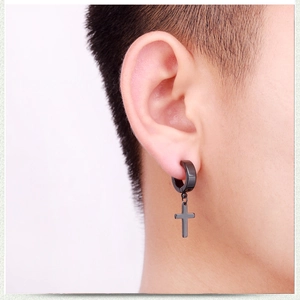 Black stainless steel cross hoop earring on male model showing a sleek metallic finish