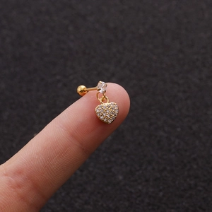 Detail of gold heart pendant ear stud with clear zircon and secure screw back design