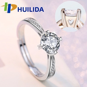 Detailed side view of silver ring showing heart-shaped hollow design and large zircon stone
