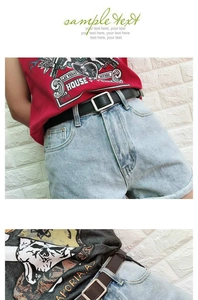 Detail of minimalist black and brown leather belts with square metal buckles on denim