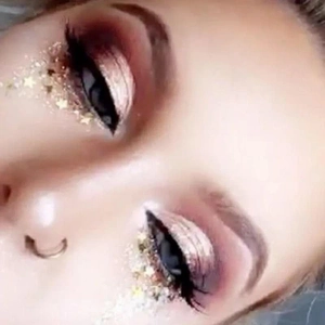 Waterproof gold star glitter face stickers and sequins for festive makeup look