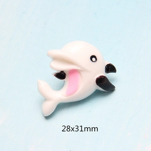 Macro detail of white dolphin resin charm for DIY crafts with 28x31mm dimension info