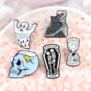 Gothic enamel pins set featuring skull and ghost designs on pink decorative crystals