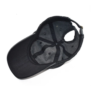 Internal view of distressed black ponytail baseball cap with metal buckle and mesh reinforcement