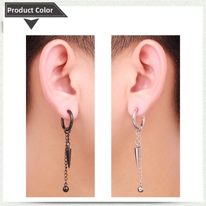 Detail view of punk style tassel earrings in black and silver finishes on ears
