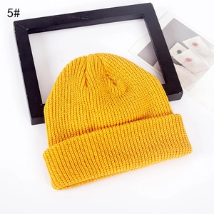 Bright yellow ribbed knit beanie with a wide cuff and dome top design for autumn winter