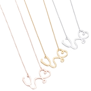 Three medical stethoscope heart necklaces in gold, rose gold, and silver stainless steel