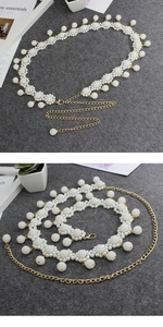 Detail of cream pearl cluster waist chain with adjustable gold-tone lobster clasp