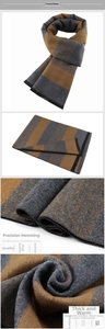 Detail of warm striped winter scarf featuring thick brushed fabric and fringe edges for men