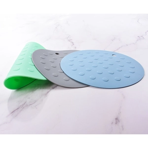 Nordic silicone round placemats with dots and hanging hole on white marble background