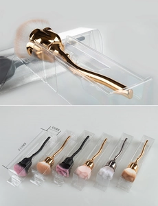 Detailed macro view of rose-shaped makeup brush with metallic handle and soft fiber bristles