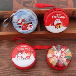 Close-up of circular Christmas coin purses with festive patterns and hanging lanyards