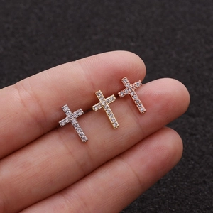 Three tiny cross stud earrings with cubic zirconia in silver, gold, and rose gold finish