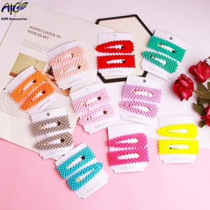 Detail of candy-colored resin bead hair clip sets in various vibrant pastel shades