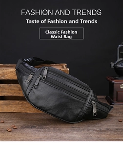 Detail of black pebbled leather waist bag showing multiple zipper compartments and texture
