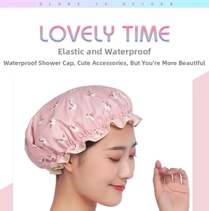 Detail of pink waterproof shower cap with elastic band and cartoon unicorn print