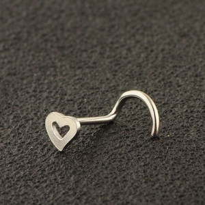 Detailed view of silver heart-shaped stainless steel nose stud with hollow design