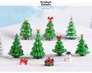 Miniature resin Christmas tree set with snowman and gifts in a snowy winter scene