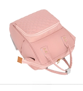 Pink nylon mummy bag with diamond quilted pocket and top handles for travel