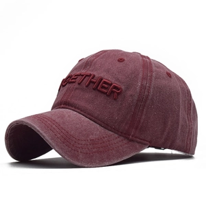 Detail of 3D embroidery on vintage washed cotton baseball cap with Together text