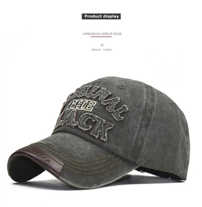 Detail of washed cotton baseball cap with BLACK embroidery and leather brim trim