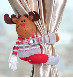 Detailed view of reindeer curtain buckle with knit sweater on silk drapes