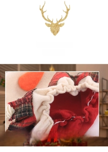 Detail of red fleece Christmas bottle cover with tartan pattern and gold deer print