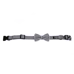 Detail of adjustable black and white gingham pet collar with bowknot and D-ring