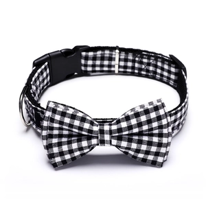 Detail of black and white plaid dog collar with bow tie and quick-release buckle