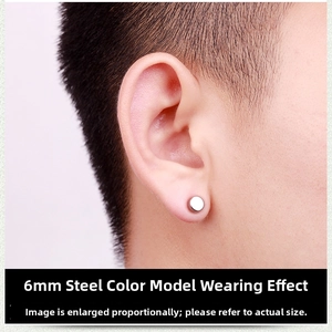 Close-up of 6mm polished steel magnetic stud earring on model's ear without piercing