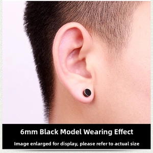 Detailed close-up of a 6mm black magnetic stainless steel stud earring on male ear