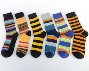 Flat lay of six pairs of striped cotton socks in various vibrant multi-color combinations