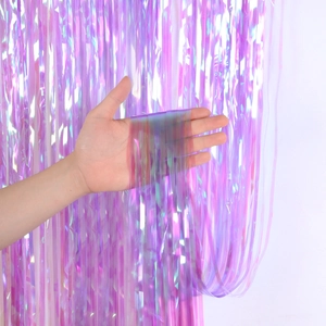 Close-up of purple iridescent foil fringe curtain showing reflective texture and drape